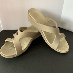 Women’s Crocs Sandals slip on. Tan wedge size 7.